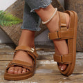 Side front view of tan platform sandals worn with jeans for summer styling