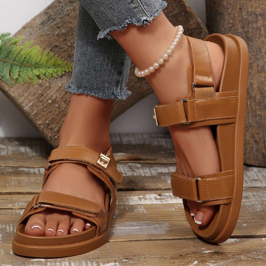 Side front view of tan platform sandals worn with jeans for summer styling