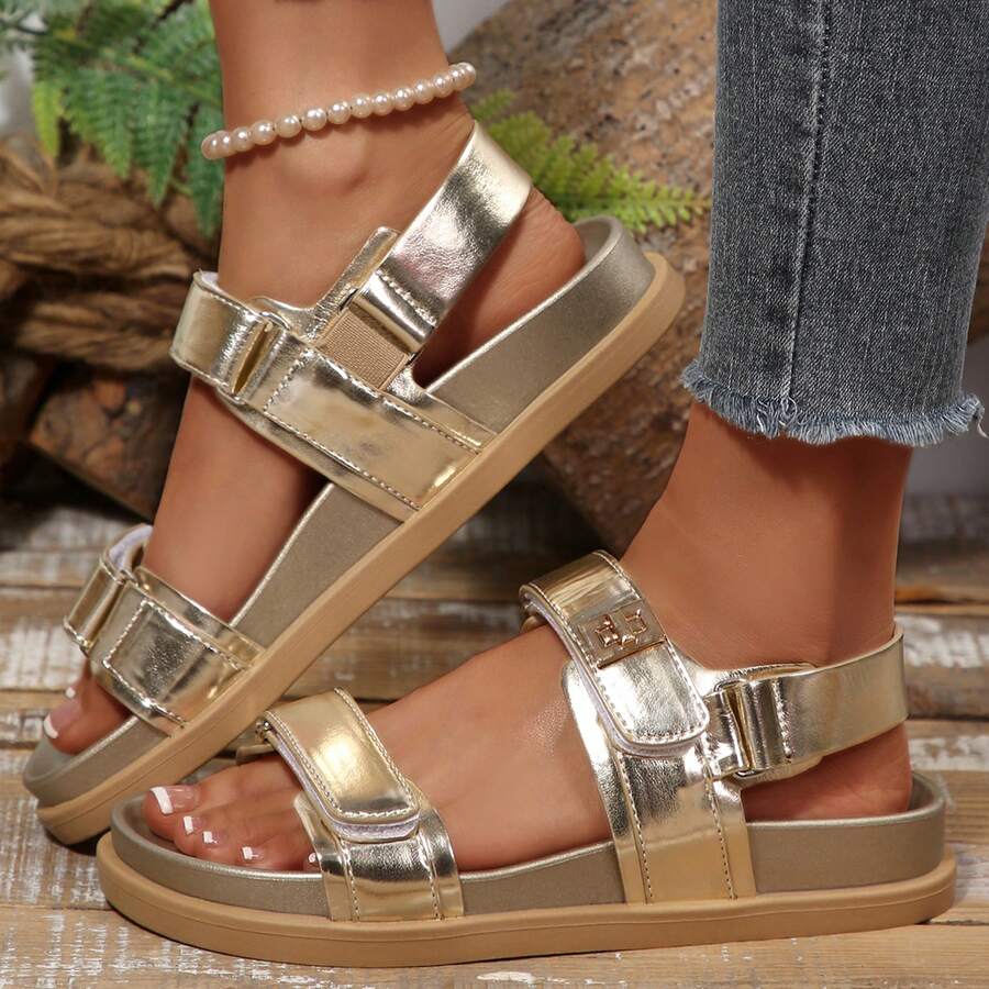 Side close-up of champagne platform sandal showing layered sole and geometric buckle