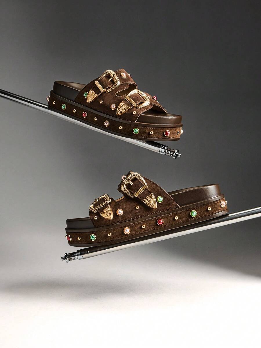 Side profile of backless double-buckle platform slide sandals in studio