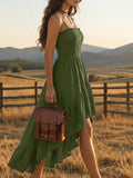 Back view of navy spaghetti strap dress with long tiered ruffle hem