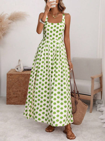 Front view cream maxi sundress with green polka dots square neck wide straps and full skirt