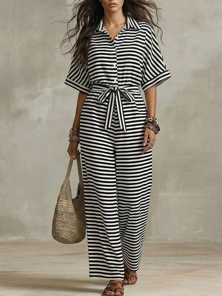 Styled view of striped belted wide-leg jumpsuit showing visible color, print, and silhouette