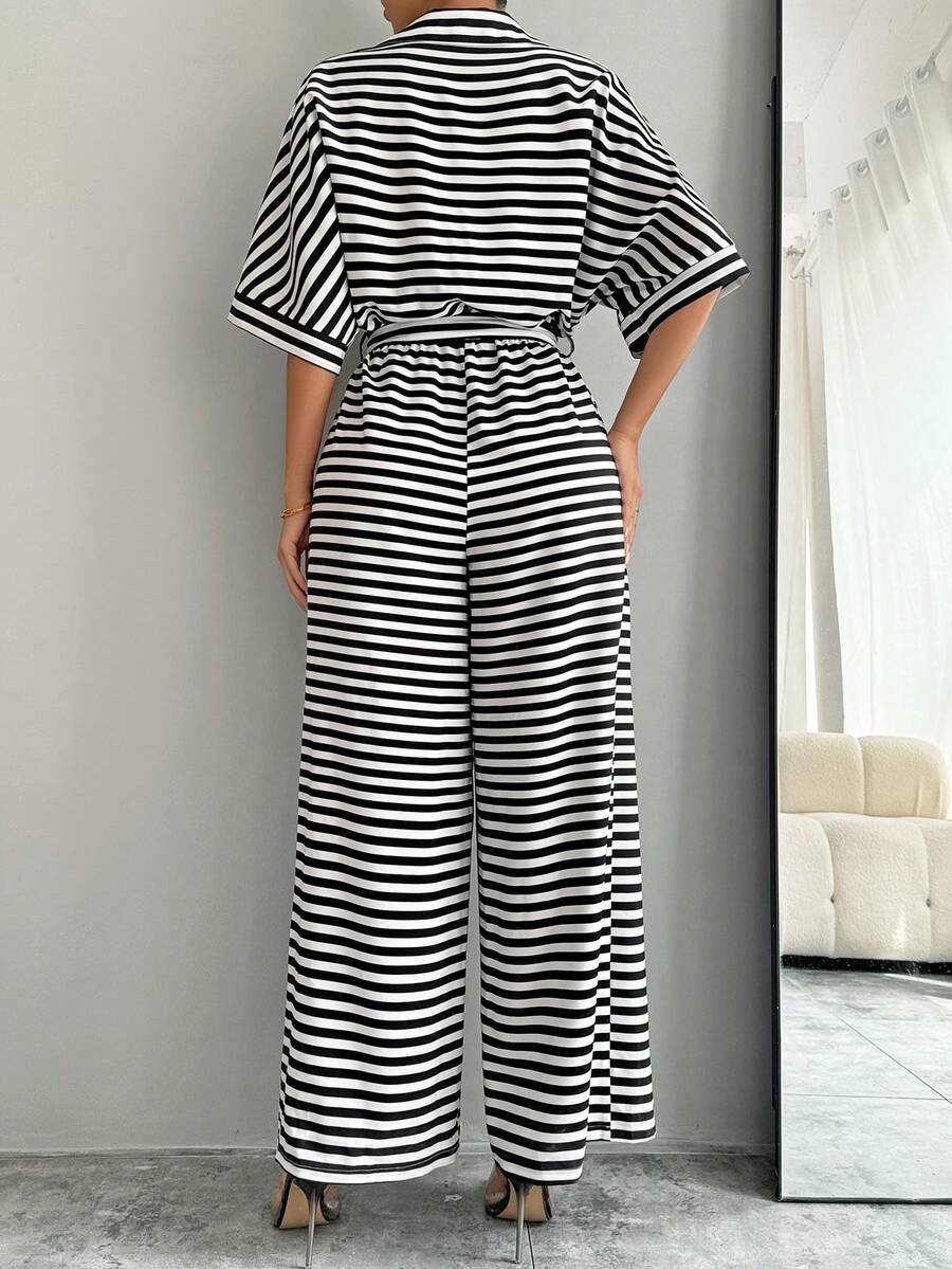 Styled view of striped belted wide-leg jumpsuit showing visible color, print, and silhouette