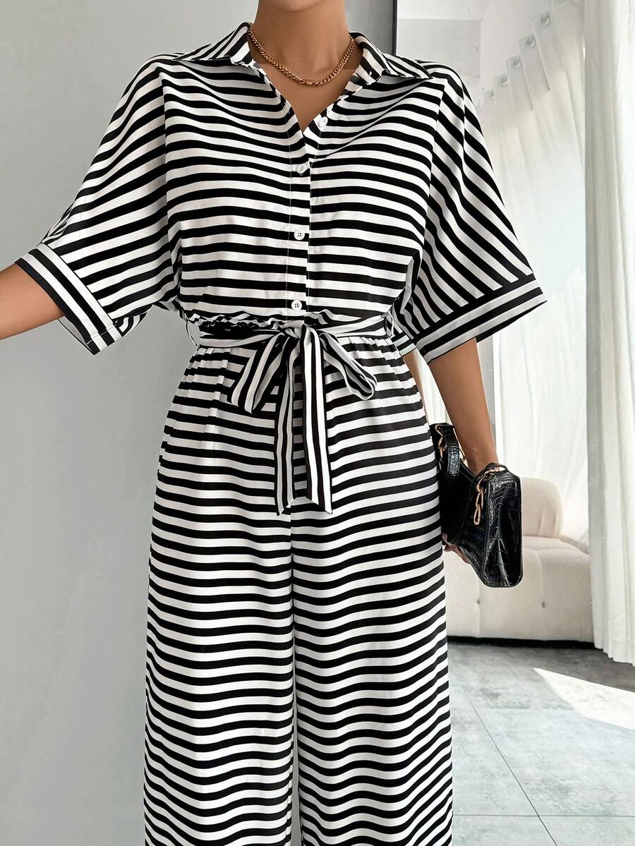 Styled view of striped belted wide-leg jumpsuit showing visible color, print, and silhouette