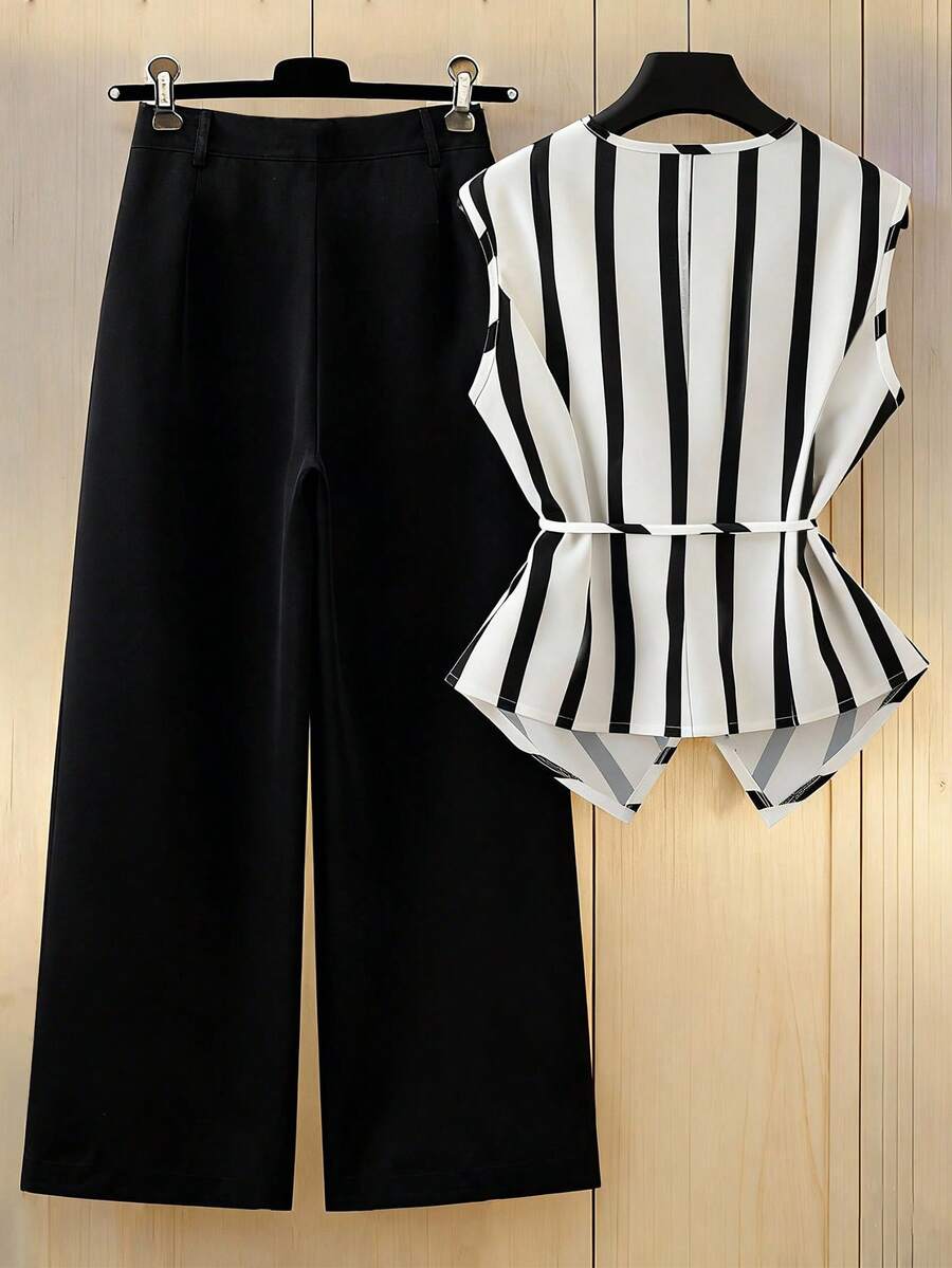 Elevate your everyday wardrobe with this sophisticated black and white striped 2-piece set, designed for effortless spring and summer style. The sleeveless V-neck blouse features a button front and functional pockets, paired with long, regular-fit pants for a polished silhouette. Crafted from a breathable polyester blend with subtle elastane stretch, this set transitions seamlessly from office to weekend outings. 
