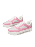 Front three-quarter pair view of pink and white rhinestone lace-up sneakers