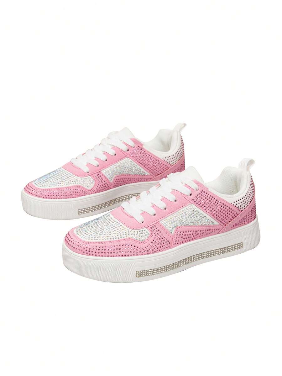Front three-quarter pair view of pink and white rhinestone lace-up sneakers