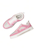 Overhead angled view of pink crystal-covered platform sneakers with white lining