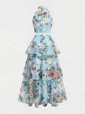 Side view of mint floral two-piece set with tiered flowing skirt