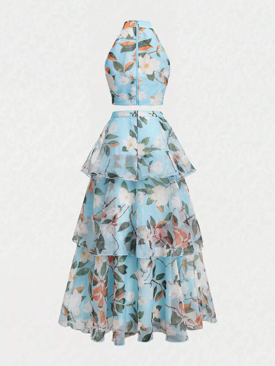 Side view of mint floral two-piece set with tiered flowing skirt