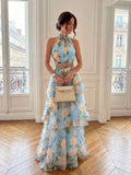 Front view of mint green floral halter top and high-waist maxi skirt