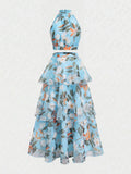Back view of mint botanical crop top and layered A-line skirt