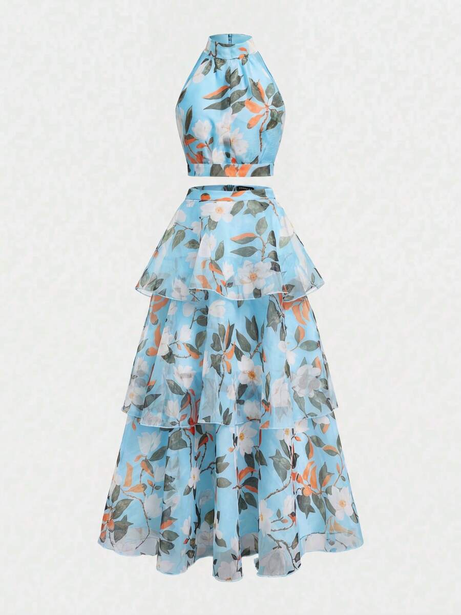 Back view of mint botanical crop top and layered A-line skirt