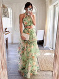 Close view of botanical floral print on halter crop top and tiered skirt