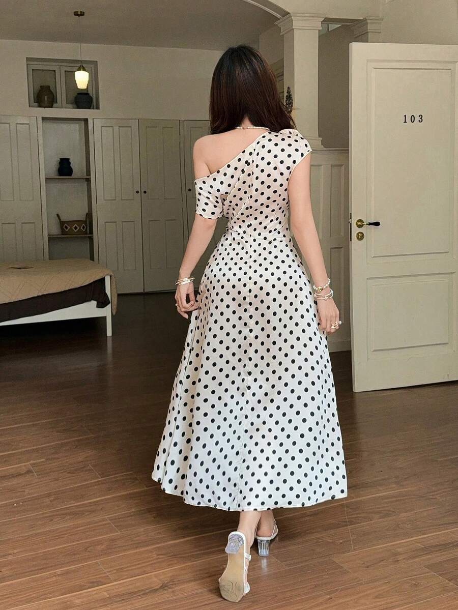 Back view of cream polka dot one shoulder maxi dress