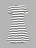 Back view of black and white mini dress with slim fit