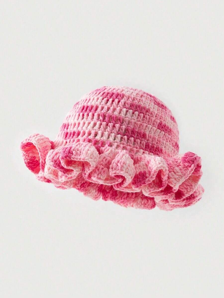 Pink tie dye crochet bucket hat with rounded crown and ruffled wavy brim