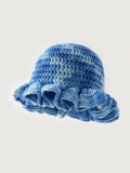 Blue tie dye crochet bucket cloche hat with chunky texture and wavy brim