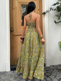 Back view olive paisley halter maxi dress with tie neck and smocked bodice