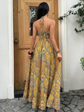 Back view mustard yellow boho halter maxi dress with tied neck straps