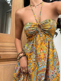 Close view mustard yellow paisley halter dress with front keyhole