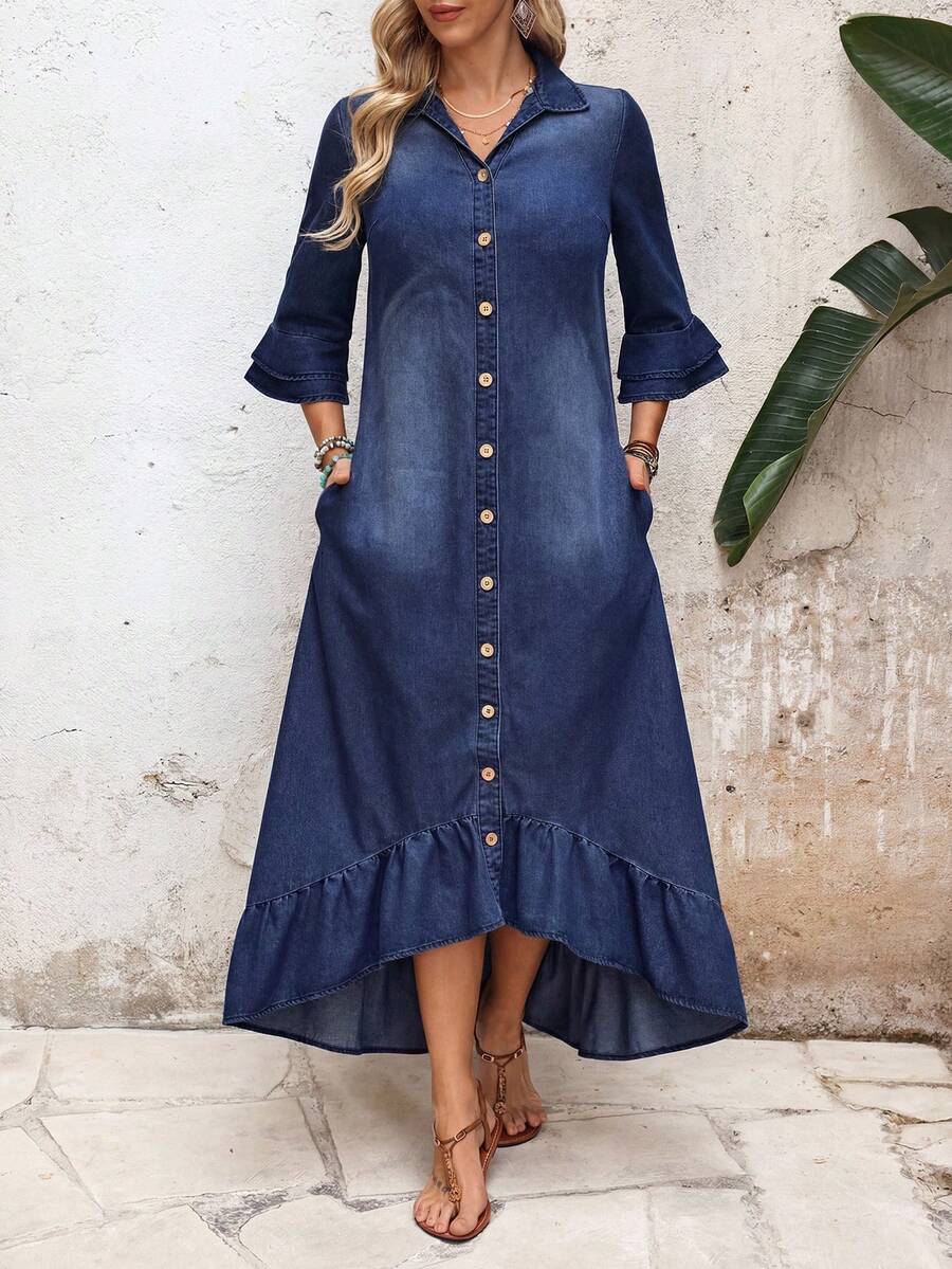 Front view of black denim shirt dress with button front pockets and ruffled hem