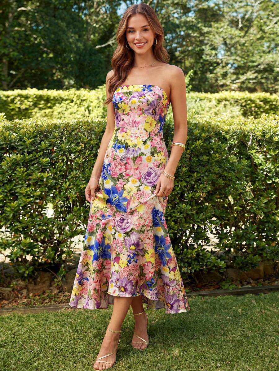 Back view of floral strapless dress with asymmetric high low hem