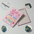 Close-up of white motivational lettering with playful star and heart accents