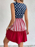 Back view of American flag print sleeveless tiered mini dress with red ruffle hem