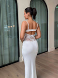 Back view of white lace maxi dress with low open back and horizontal band