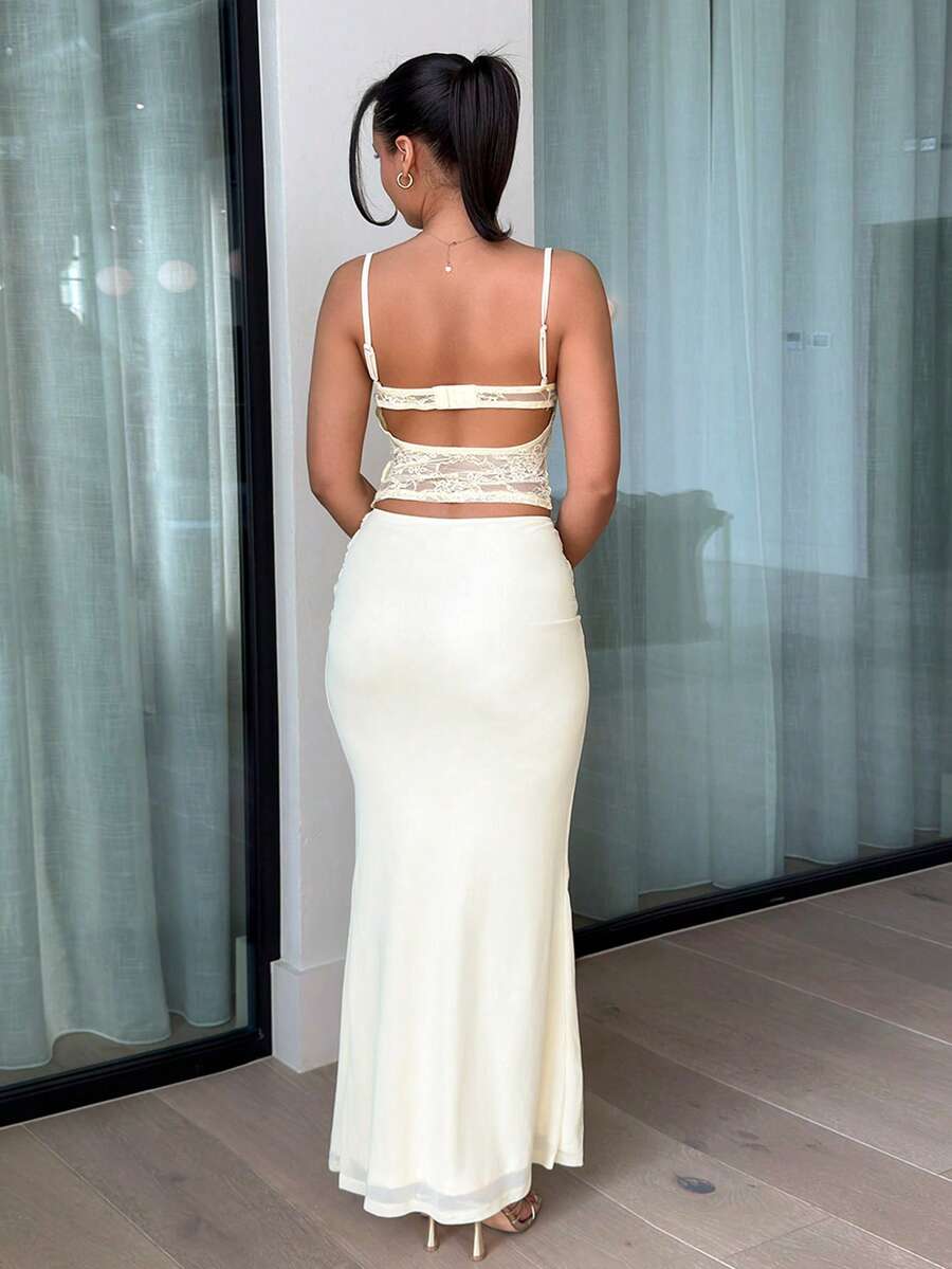 Front view of pale yellow lace cami top and matching maxi skirt set