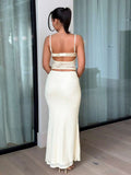Back view of yellow two piece set with lace cami cutout back and long skirt