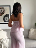 Back standing view of pink striped lounge set with spaghetti strap cami top