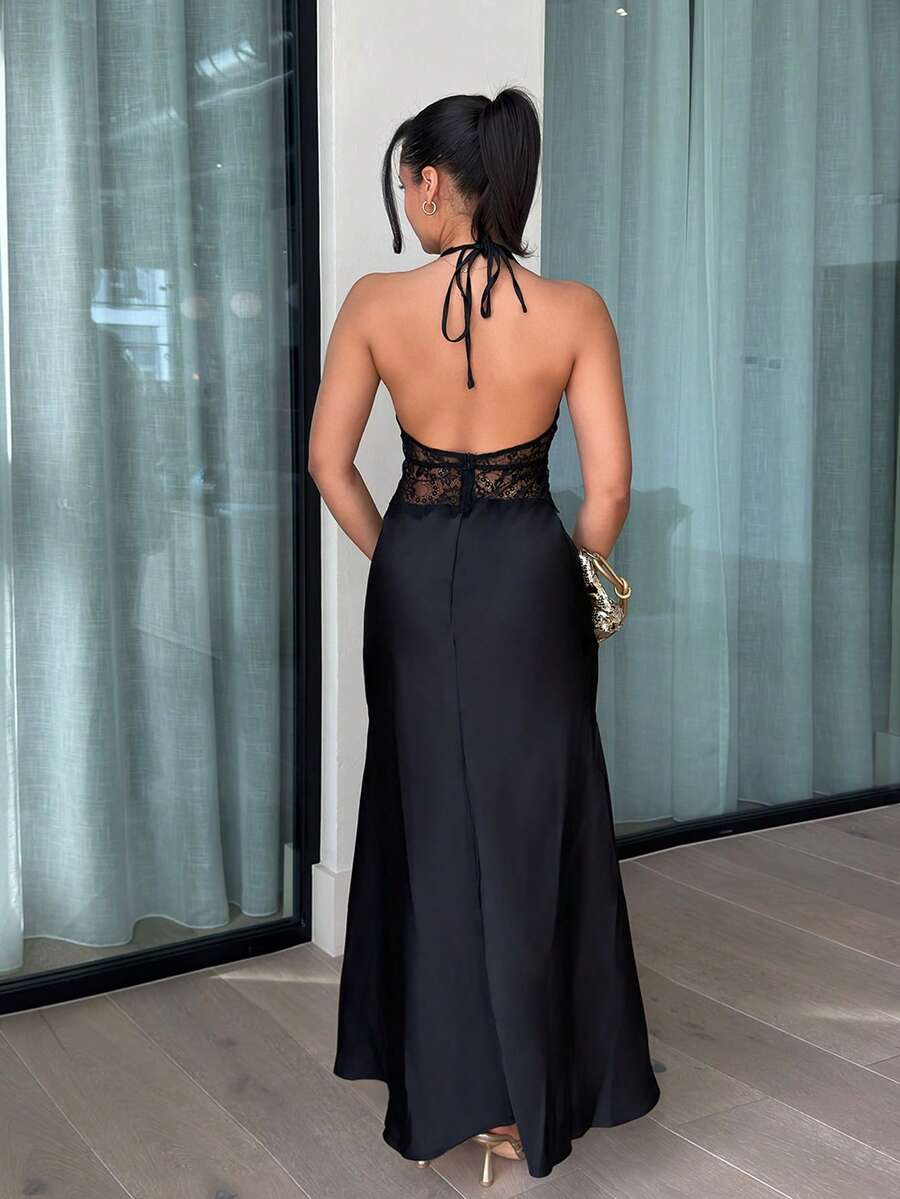 Front view of black halter satin maxi dress with plunging neckline and lace waist insert
