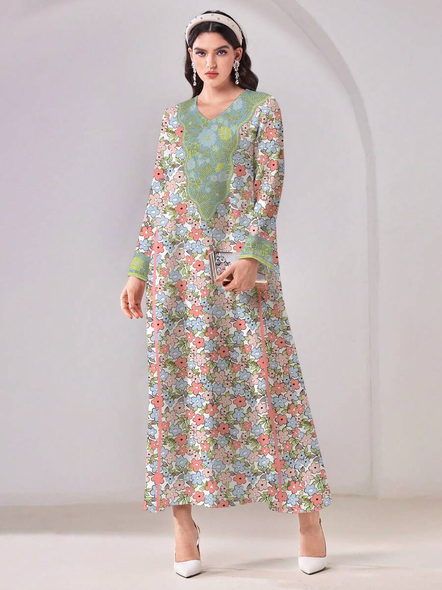 Embrace modest elegance with the Al-Najma Casual Floral Print Arabic Dress. This sophisticated tunic features a delicate floral pattern in multicolor tones, perfect for formal occasions and festive celebrations. The V-neckline and natural waistline create a flattering silhouette, while the long sleeves and flowing loose fit provide comfort and grace. Crafted from a breathable woven fabric blend of 95% polyester and 5% elastane with medium stretch, this dress moves with you throughout your day. 