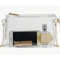 Front view of clear transparent PVC shoulder bag with white zipper trim and gold chain strap