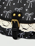 Black kawaii shoulder bag showing bow print rounded body and hardware