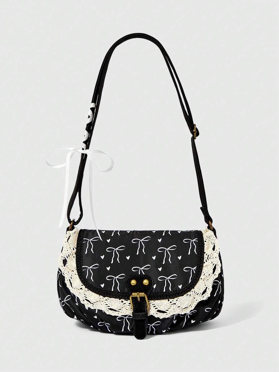 Black corduroy bow print shoulder bag with cream lace trim and buckle strap