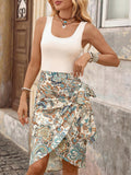 Close front view of white sleeveless bodice and side-tie paisley wrap skirt