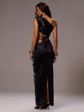 Close-up of beaded one-shoulder dress for beach and vacation looks