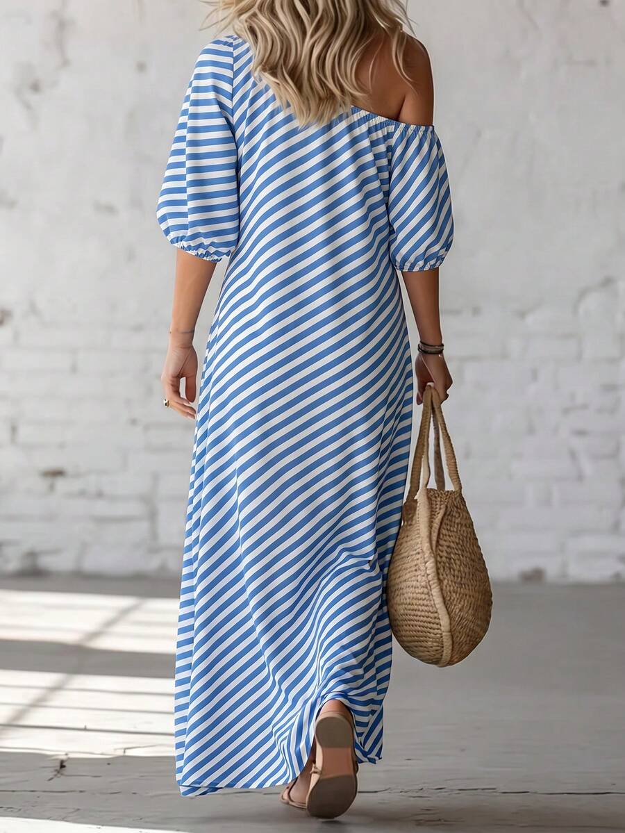 Front view blue and white diagonal striped one-shoulder maxi dress with puff sleeves and flowing hem