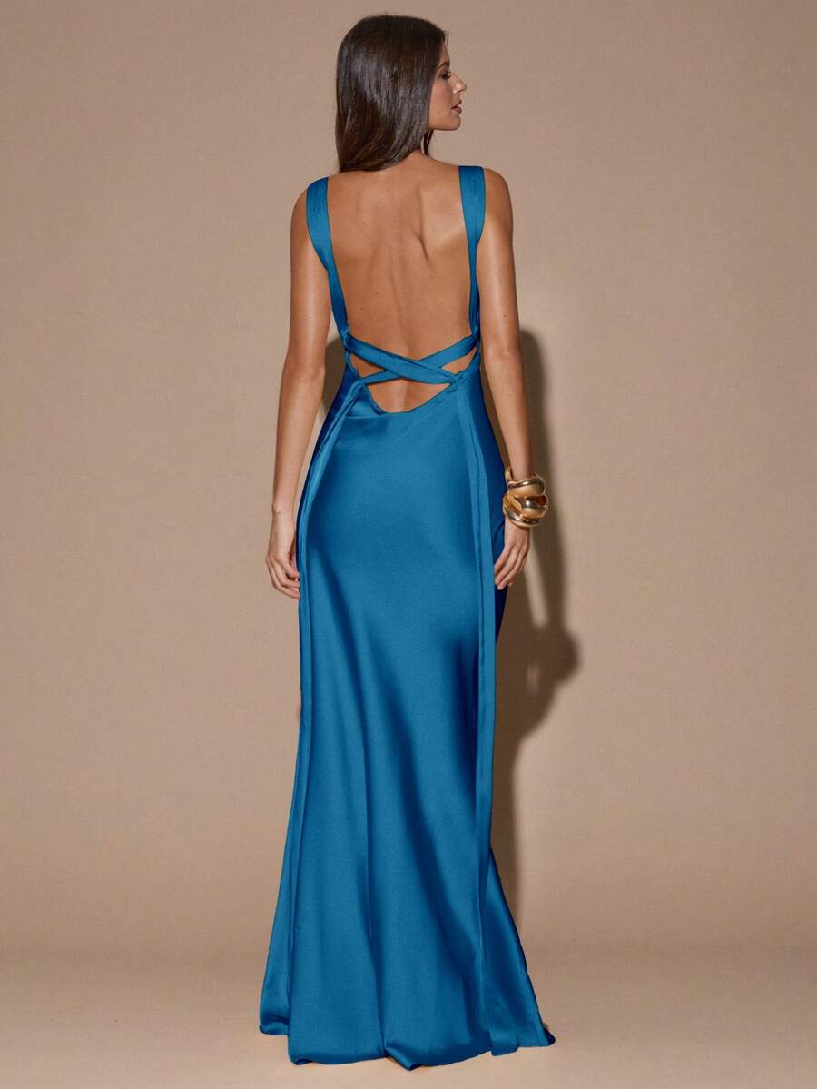 Front view of dark brown with white polka dots sleeveless deep V-neck maxi dress with crossed open back, shown for wedding and evening wear