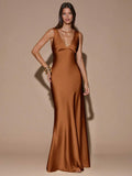 Back view of teal blue sleeveless deep V-neck maxi dress with crossed open back, shown for wedding and evening wear