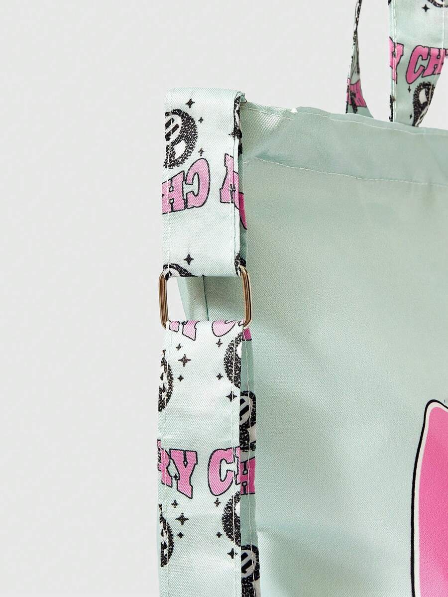 Lifestyle view of mint graphic tote bag worn on shoulder