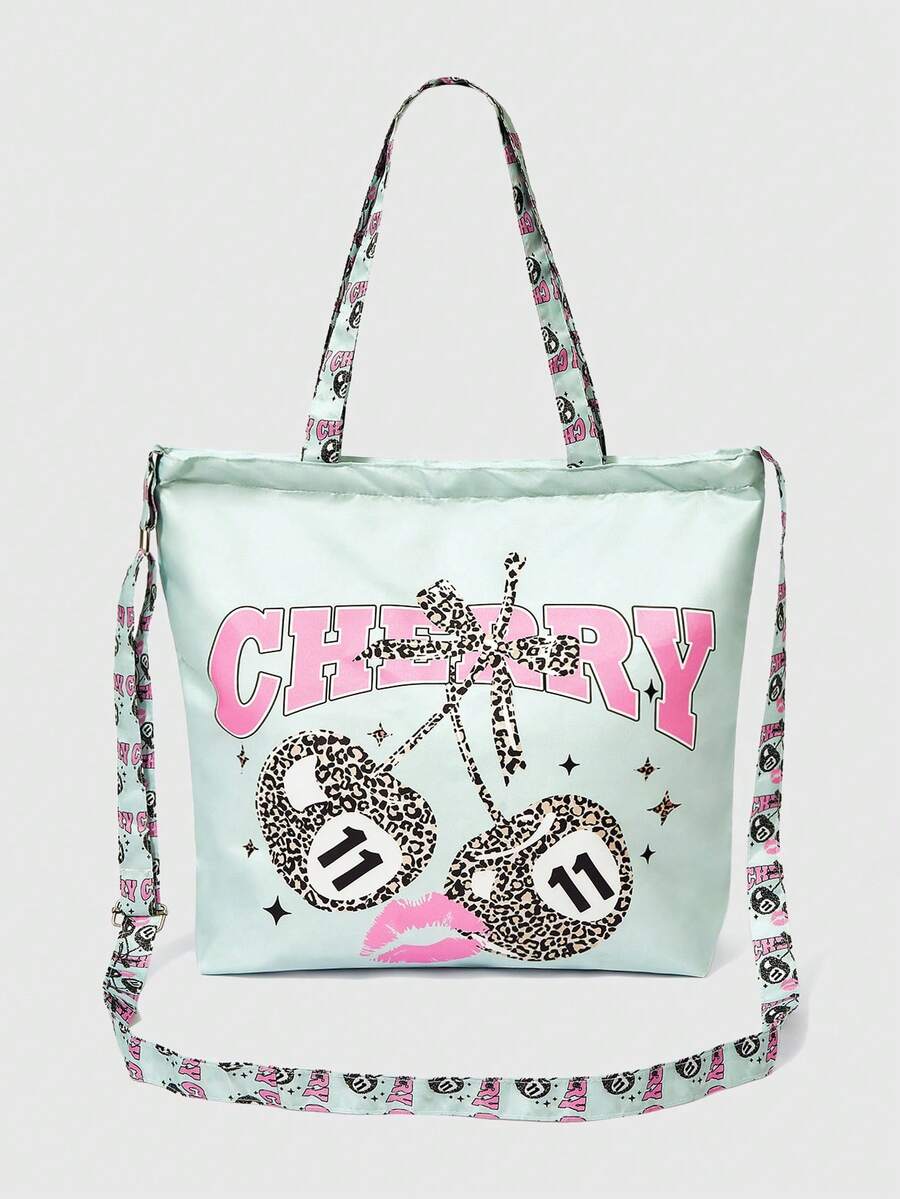 Detail view of mint cherry print bag showing strap hardware and glossy fabric