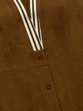 Close detail of brown button placket with striped trim and textured woven fabric