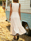 Back view of sleeveless cream maxi dress with waist seam and ruffled lower hem