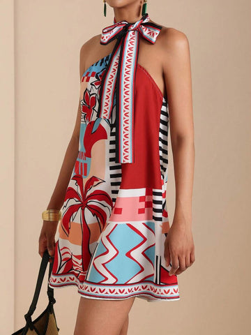 Front close view of red tropical geometric halter mini dress with neck tie bow