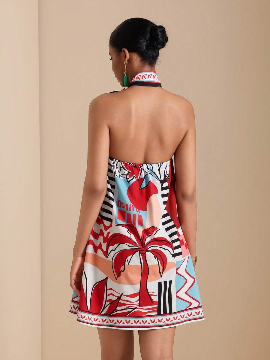 Back view of printed halter short dress with open back and elastic top edge